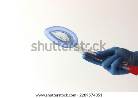 Laryngeal mask airway (LMA) in a health professional hands wearing gloves  Royalty-Free Stock Photo #2289574851