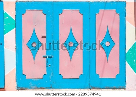 Cheerful Mix of Patterns and Colors Vibrant Textures and Patterns: Metal Doors with Colorful Backgrounds