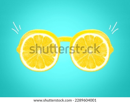 Summer sunglasses made of lemon slices. Creative summer layout. Fruit minimal concept Royalty-Free Stock Photo #2289604001