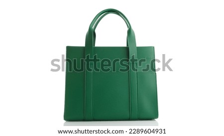 Women's green handbag on a white background with reflection Royalty-Free Stock Photo #2289604931