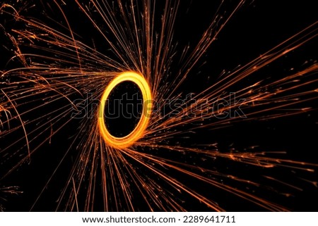 Witness the enchanting beauty of the bengal firework circle shining bright in the darkness of the night Royalty-Free Stock Photo #2289641711