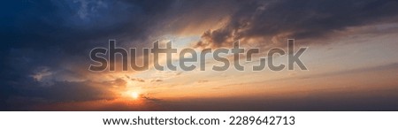 golden hour with this breathtaking image of a radiant sunset. The warm colors and illuminating clouds create a magical glow that will transport you to another world Royalty-Free Stock Photo #2289642713