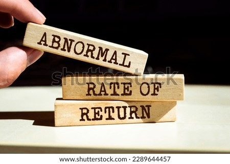 Wooden blocks with words 'Abnormal Rate of Return'. Royalty-Free Stock Photo #2289644457