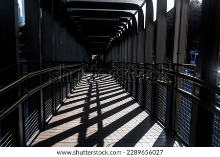 Beautiful pedestrian bridge in Jakarta city. Silhouette photo