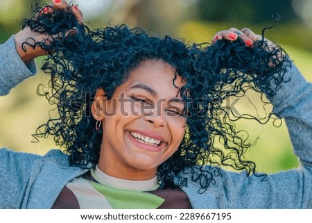 outdoor portrait of smiling latin girl