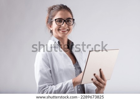 woman, lab coat, glasses, digital tablet, smiling, positive news, scientific, technology, modern technology, data analysis, research, knowledge, expertise, precision, technical skills, high-tech tools Royalty-Free Stock Photo #2289673825