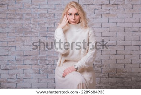 Young stylish blonde European woman .Casual fashion. Plus size model. Happy overweight woman