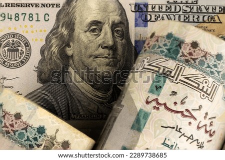 Egyptian pound and US dollars top view.Exchange rate, inflation, and Egyptian economy concept Royalty-Free Stock Photo #2289738685