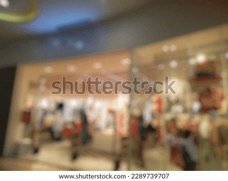 Defocused Abstract Blurred image side view exterior of the fashion store inside modern shopping mall. Vintage tone effect image for background use 