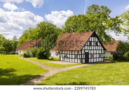 Old half-timbered house in a village in Germany Royalty-Free Stock Photo #2289745783