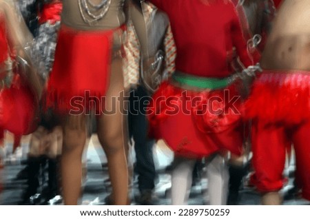 Dancing at Festa Junina, translated to June Party. Blurred background for party and dance.