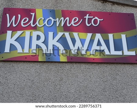 kirkwall sign scotland church red flowers cemetery