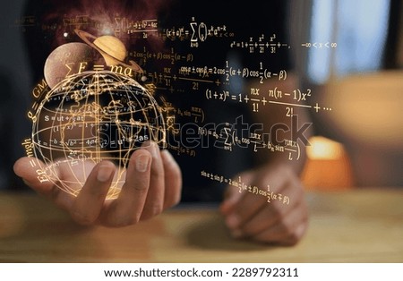 A student or physics scientist holds a globe to study laws of gravitational force from stars in solar system that affect our planet and phenomena such as sea level or heat waves from solar storms. Royalty-Free Stock Photo #2289792311