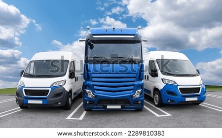 Vans and truck are parked in row. Commercial fleet Royalty-Free Stock Photo #2289810383