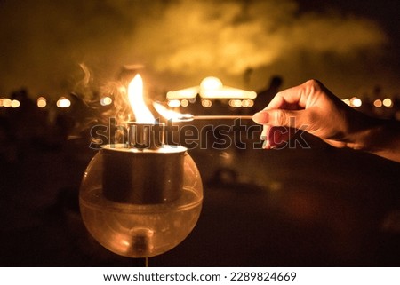 Buddhist set fire to the lantern to homage the Lord Buddha in holy day, Makha Puja Day in Thailand