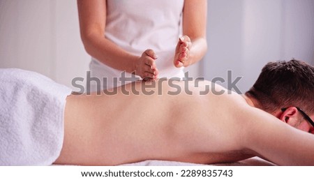 Men Getting Acupuncture Massage Chiropractic Therapy Or Physiotherapy Royalty-Free Stock Photo #2289835743