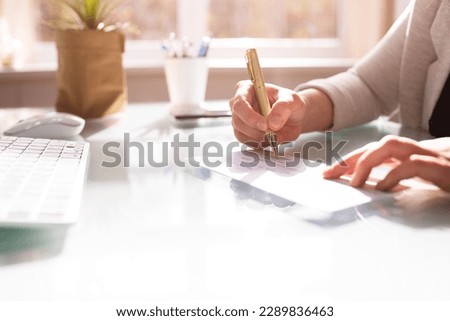 Insurance Paycheck. Payroll Check. Hand Writing Cheque Royalty-Free Stock Photo #2289836463