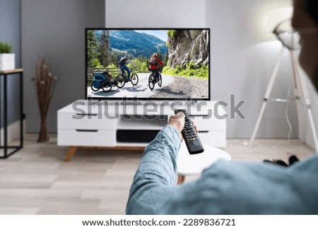 Watching TV Movie On Couch In Living Room Royalty-Free Stock Photo #2289836721