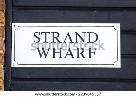 A sign on the facade of Strand Wharf, in the Old Leigh area of Leigh-on-Sea in Essex, UK.