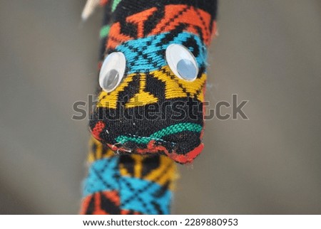 mexican boy playing with handmade toys
