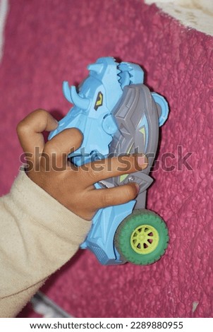mexican boy playing with handmade toys