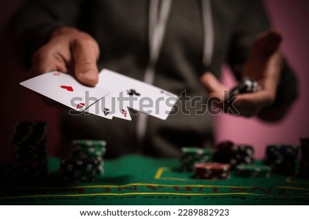 Devastated gambler man losing a lot of money playing poker in casino, gambling addiction. Divorce, loss, ruin, debt, ludopata concept. Royalty-Free Stock Photo #2289882923