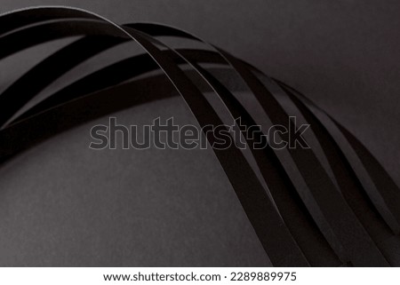 Black 3d background with curved stripes