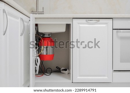 In-Sink-Erator disposal garbage build in the kitchen furniture Royalty-Free Stock Photo #2289914791