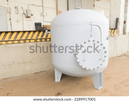 Air receiver for various media, used as a storage tank for compressed gas or liquid under pressure, and as a buffer capacity for smoothing out pressure fluctuations in gas on industrial plants Royalty-Free Stock Photo #2289917001