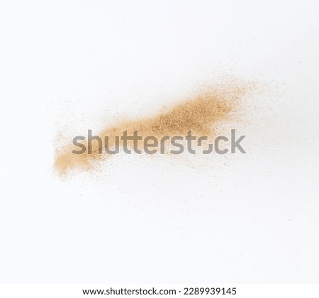 Sand flying explosion, Golden sand wave explode. Abstract sands cloud fly. Yellow colored sand splash throwing in Air. White background Isolated high speed shutter, throwing freeze stop motion Royalty-Free Stock Photo #2289939145