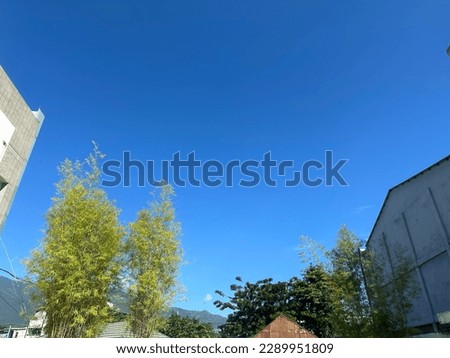 view of the blue sky during the day over the building