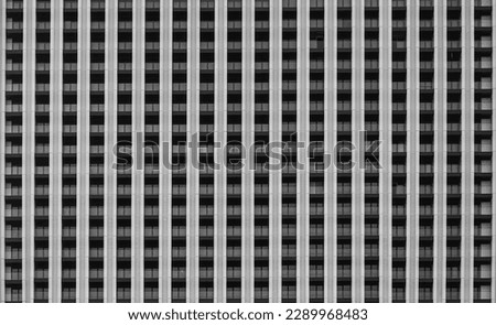 background of new high rise apartment building wall with many balcony and a lot windows. facade, exterior backdrop. facade of a multi-storey residential building. 