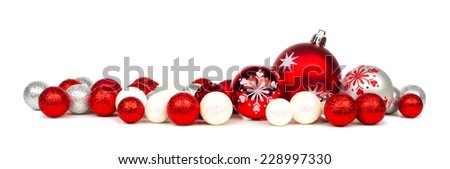 Long Christmas border of red and white ornaments over a white background