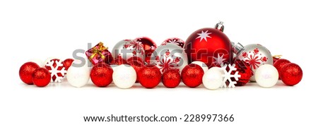 Christmas border of red and white ornaments over a white background