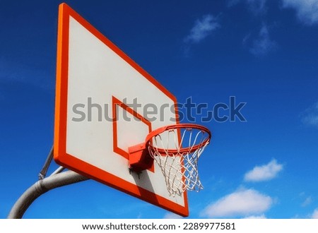 Basketball Dreams - Basketball Hoop Against A Blue Sky
