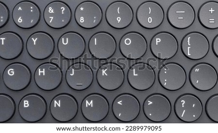 Modern laptop computer keyboard. Laptop keyboard. Detail of the new and ergonomic computer keyboard with lighting