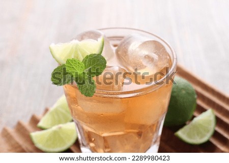 fresh ice tea with lime and mint leaves