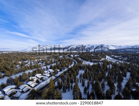 An Aerial View of Mammoth Lakes, California in winter with snowy mountains in the background