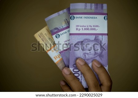 Portrait of the new Rp. 100,000 and Rp. 5000 issues in 2023. Indonesian rupiah currency