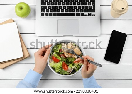 Office employee having business lunch at workplace, top view