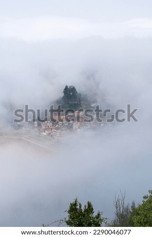The landscape of Sa Pa town in the morning fog, taking a picture at the viewpoint, top tourist attractions in Vietnam.