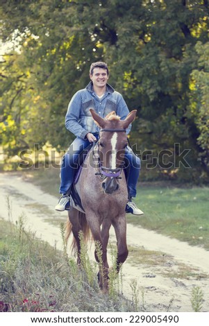 horse ride young guy autumn forest