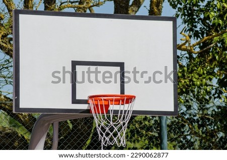 basketball basket in an outdoor court Royalty-Free Stock Photo #2290062877