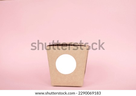 Round sticker mockup on kraft box, lunch box, packaging with blank sticker, adhesive label, food box, pink background