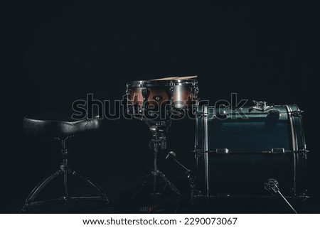 Drum set on a black background close-up, musical background.