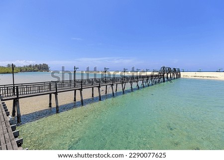 Panoramic picture along wooden bridge over Bo Dan River at Natai Beach in Thailand during day time