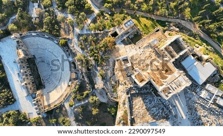 Aerial drone top down photo from iconic ancient theatre of Herodes Atticus and Propylaea Acropolis hill main entrance, Athens historic centre, Attica, Greece                               Royalty-Free Stock Photo #2290097549
