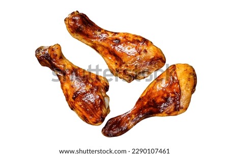 BBQ Grilled chicken drumsticks on a wooden cutting board. Isolated on white background Royalty-Free Stock Photo #2290107461