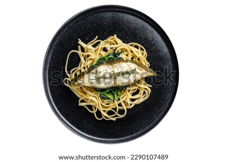 Spaghetti pasta with Halibut fish steak and spinach. Isolated on white background