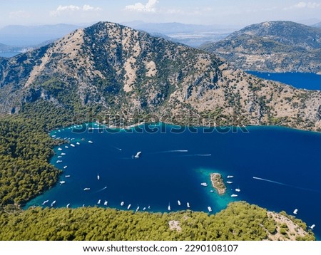 Aerial drone photo of  Hamam bay, located in the midst of Göcek and Dalaman, Fethiye. Daily tour boats and private yachts anchor to have serenity and enjoy the secluded bay.